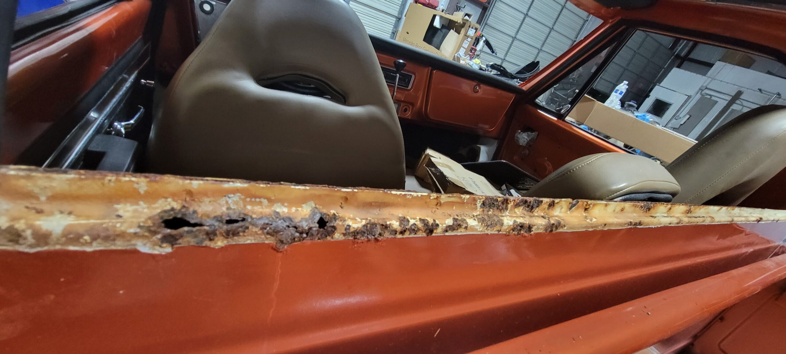 rust in the back window of an old truck